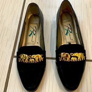 Ros Hommerson black with elephants in gold on top